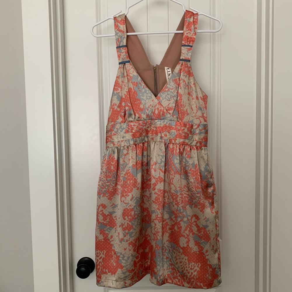 Orange and cream mosaic back cut out dress.